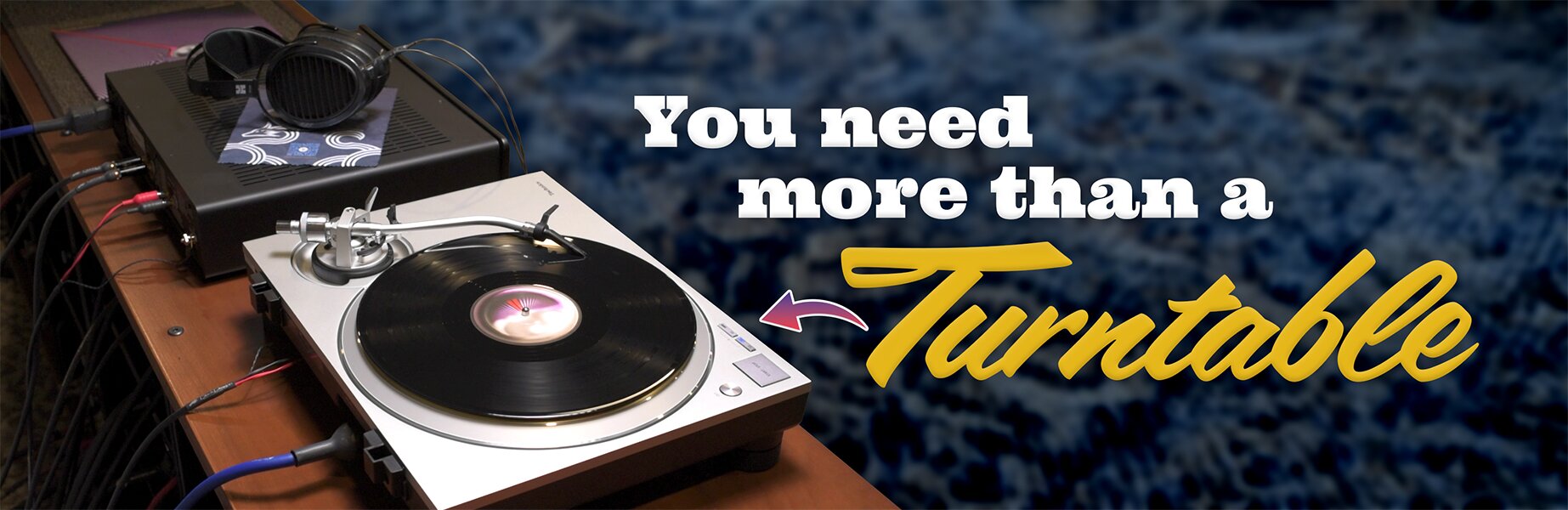 you need more than a turntable. Turntable next to other audio gear and headphones