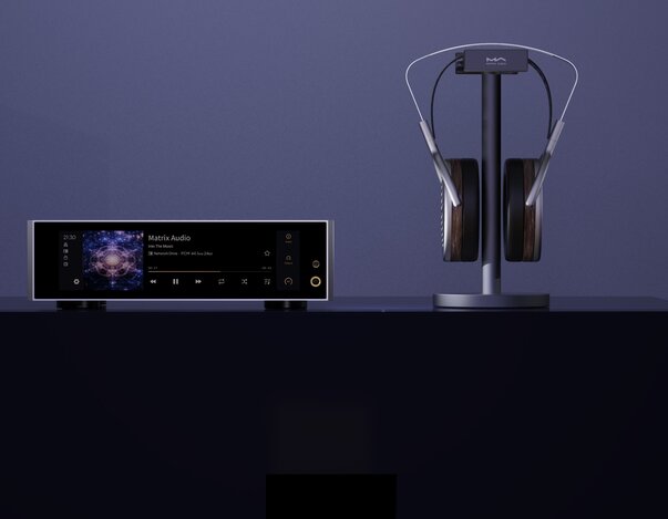 Matrix Audio TS-1 Streaming Music Server DAC and headphone amplifier sitting on a table with a pair of HiFiMan headphones next to the unit on a headphone stand. 