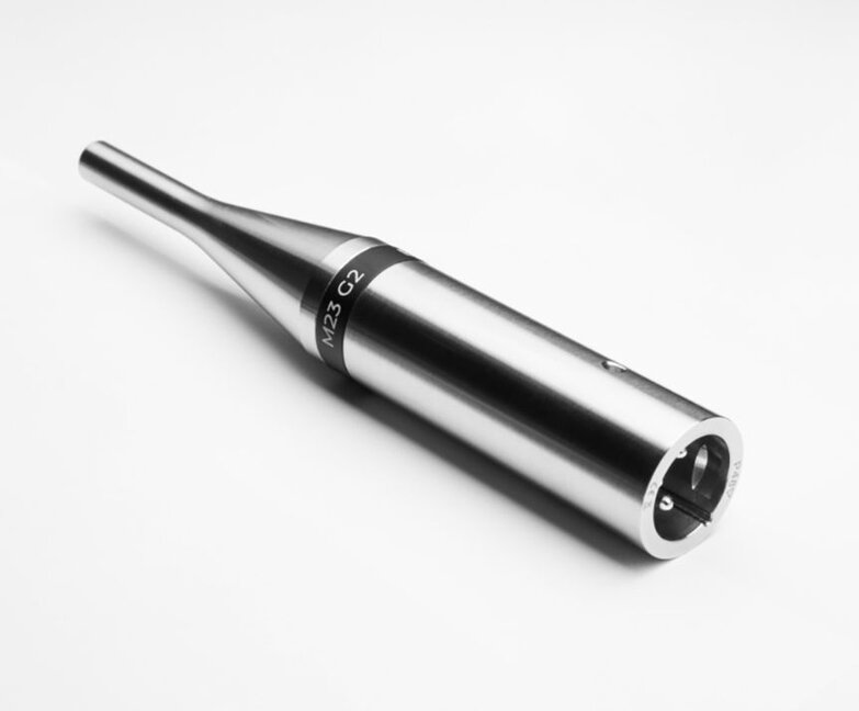 m23 g2 mic tilted, lying flat on a white surface