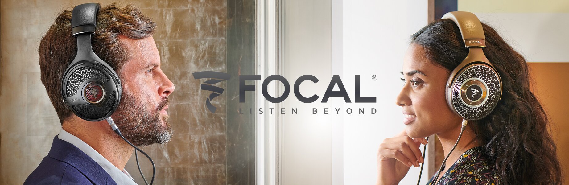 Two individuals wearing the Focal Utopia 2022 Headphones and Focal Clear MG Headphones