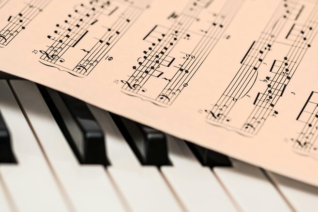 piano keys with music sheet