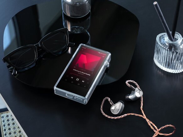 Astell&Kern PD5 DAP with a pair of IEMs next to it 