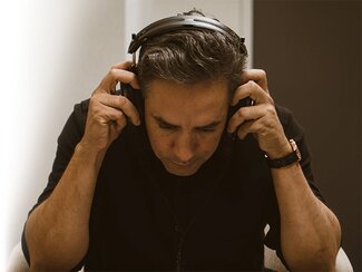 Man wearing the Audeze MM-500 Headphones