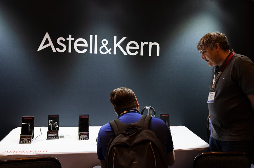 Moon Audio employee Ricky Kovacs sits at Astell&Kern exhibition table