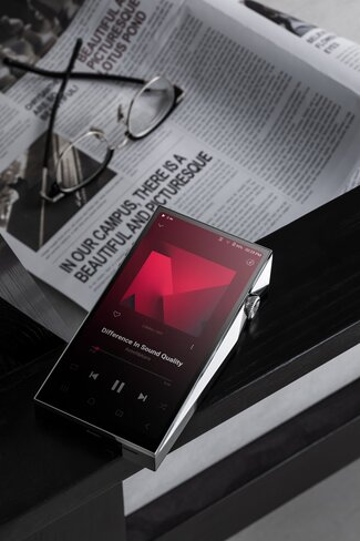 Astell&Kern SP4000 Digital Audio Player on top of newspaper 