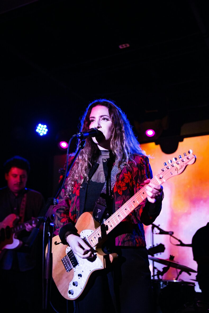 female lead singer with guitar