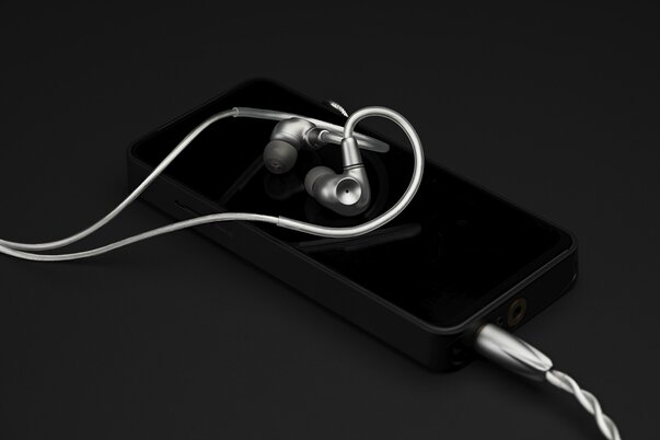 Meze Audio ASTRU IEMs connected to an Apple iPhone via the stock cable