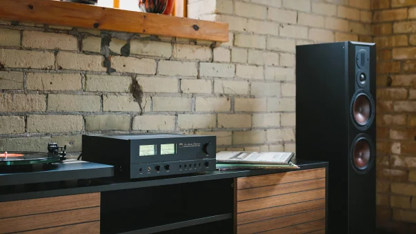 NAD Classic Series component on a table next to a turntable and loudspeaker