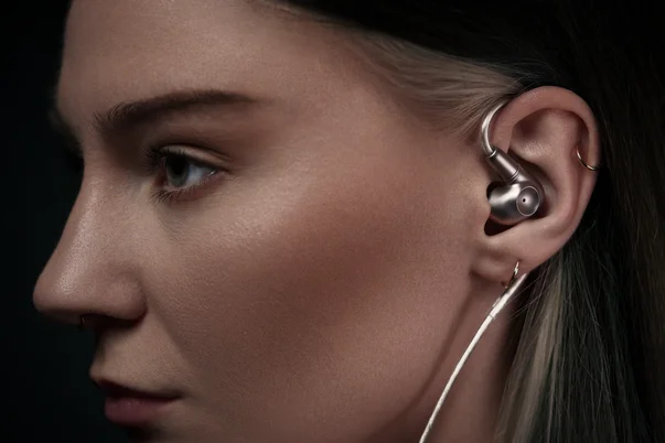 Woman wearing meze audio astru iems up close