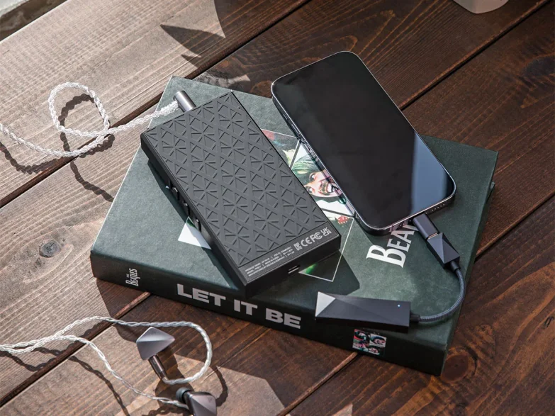 phone connected to AK PA10 on the book lying on the table