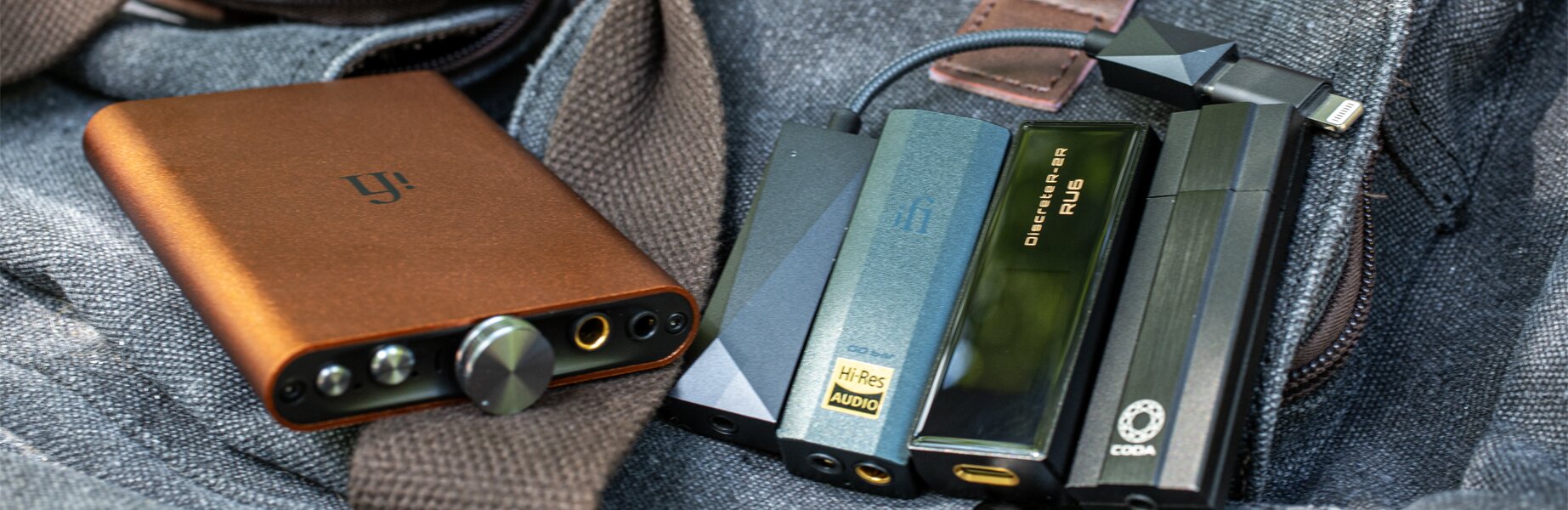 Portable DACs on a messenger bag outside