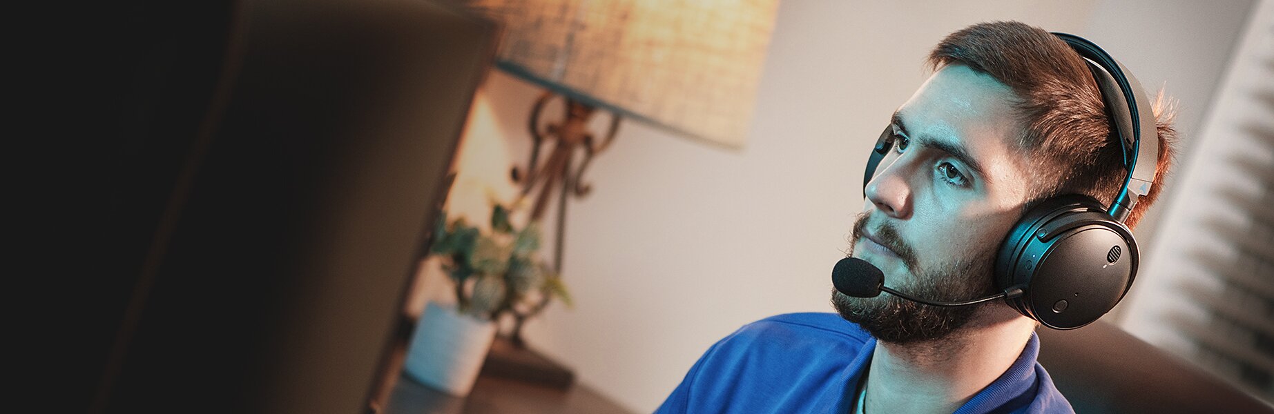 Man wearing the Audeze Maxwell Gaming Headphones
