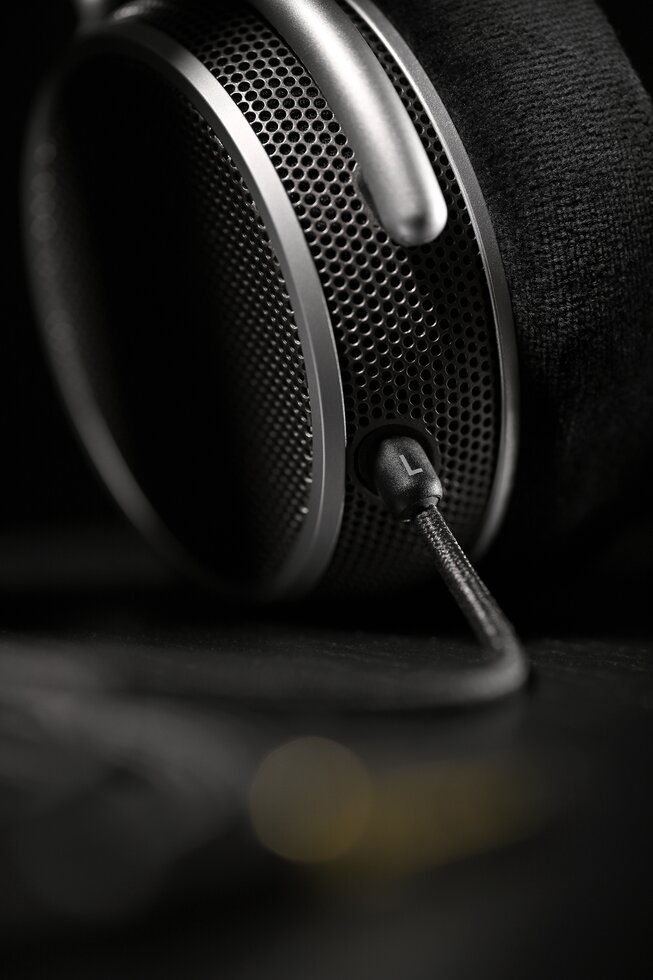 Close-up of OAE2 earcup with cable port closest to lens