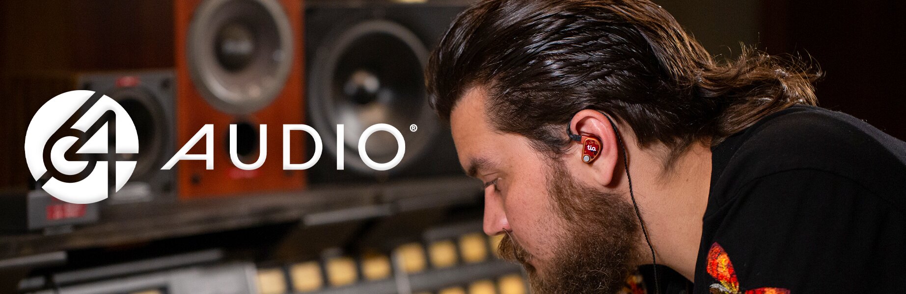 man wearing 64 Audio IEMs with 64 Audio logo displayed 