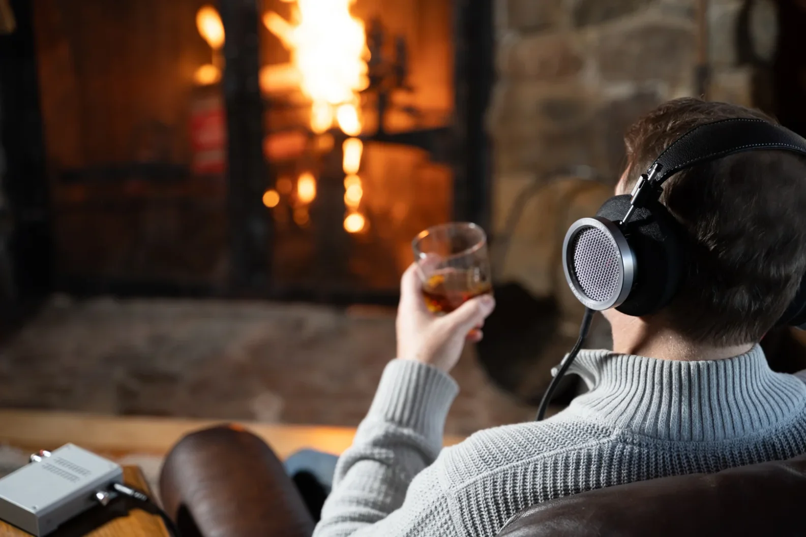 HP100 SE on man facing fire with drink