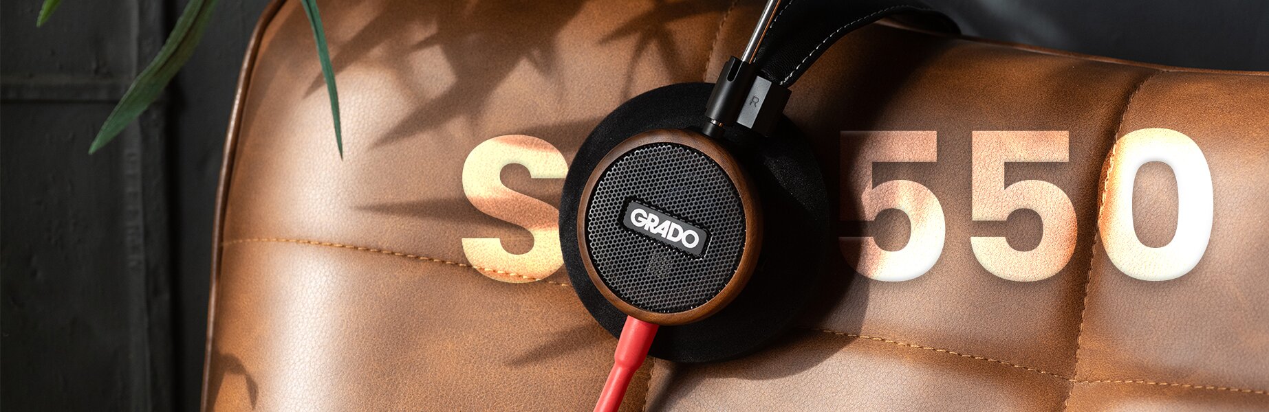 Grado Signature S550 Headphones placed over the back of an armchair