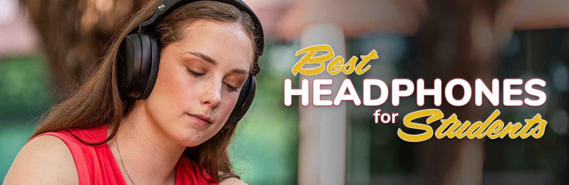 Best headphones for students. Woman wearing Sennheiser Momentum 4 wireless headphones