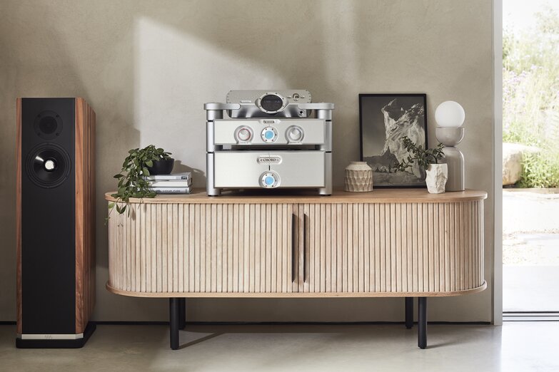 Ultima 6 Amplifier on cabinetry next to the speaker
