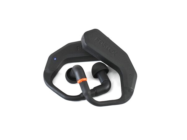 TM2 True Wireless Stereo In-Ear System laying flat on white background