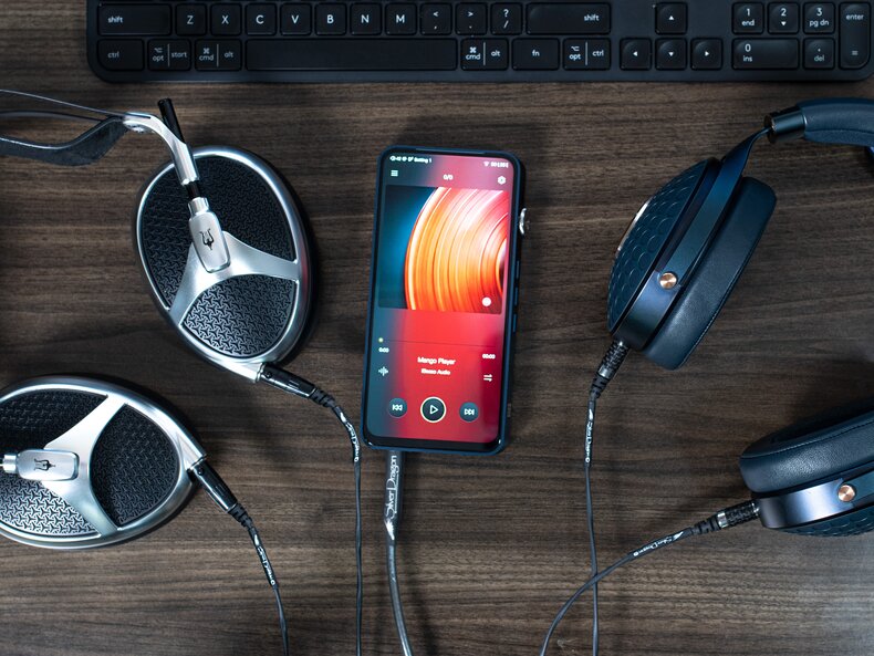 iBasso DX320 with Meze Elite and Focal Celestee Headphones on a table with keyboard