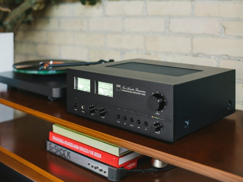 C 3030 on wooden shelf next to turntable