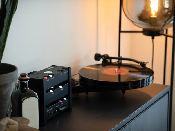 Chord Electronics Huei Phono Preamp next to a turntable