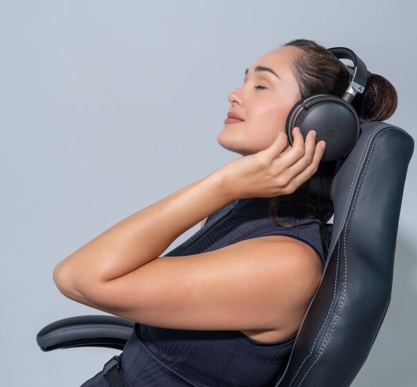 Audeze Maxwell 2 ANC Wireless Gaming Headset on a woman's head