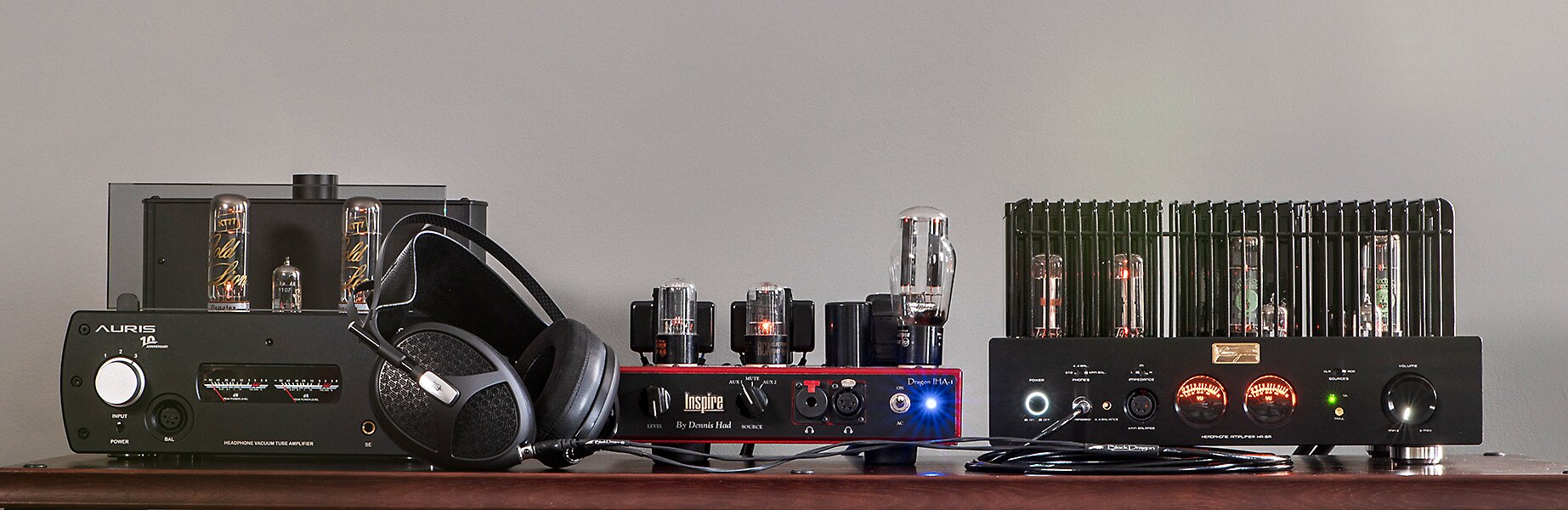 Auris Nirvana IV Tube Headphone Amplifier, Moon Audio Dragon Inspire IHA-1 Tube Headphone Amplifier, Cayin HA-6A Tube Headphone Amplifier, and Meze Audio Empyrean 2 Headphones grouped together