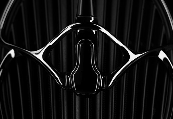 Meze Audio ARTA Headphones close up of silver metal accents on ear cup grille