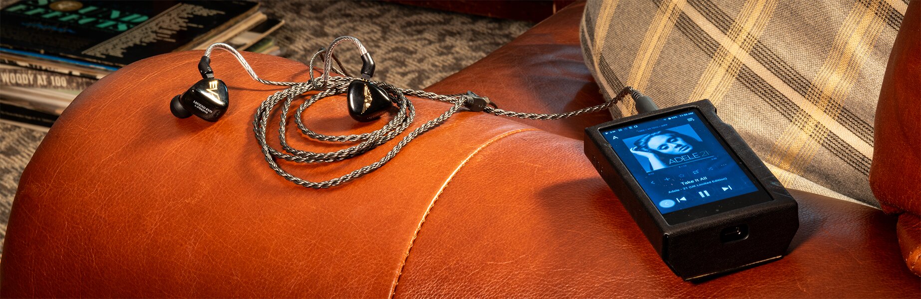 Empire Ears LEGEND EVO IEM connected to Digital Audio Player illuminating Adele 21 album cover on screen 