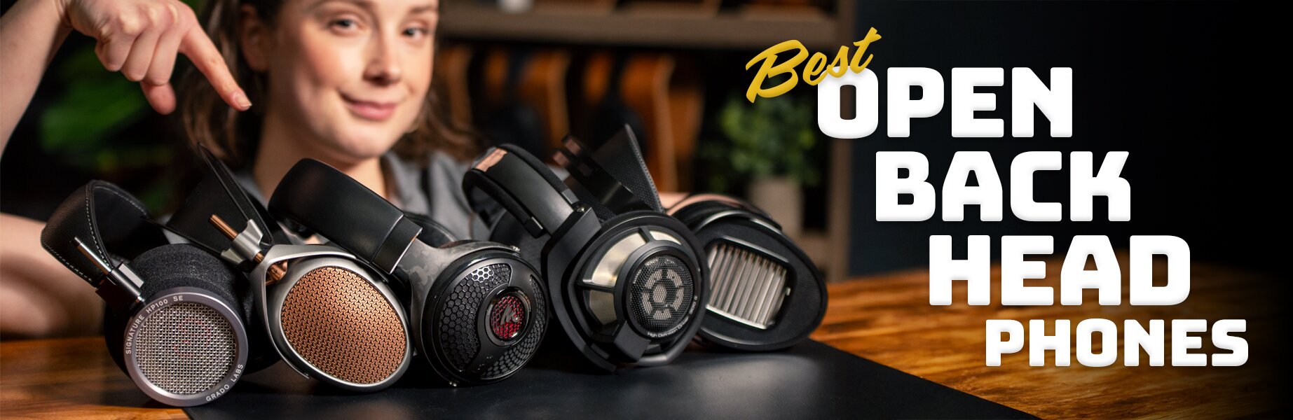 best open-back headphones woman standing behind five headphones