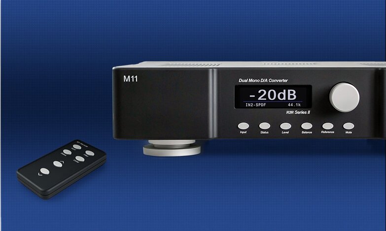 left side close up of m11s2 with blue background, with remote next to each