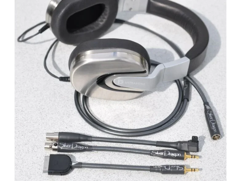 headphones next to adapter cables