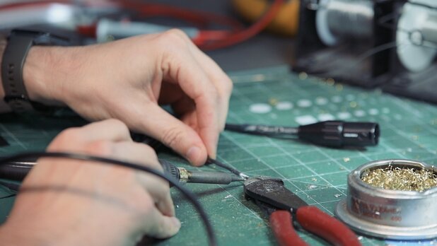 moon audio technician crafting a dragon audio cable