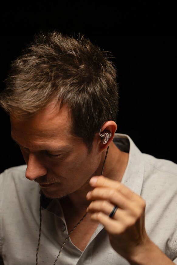 man with ocean iems in