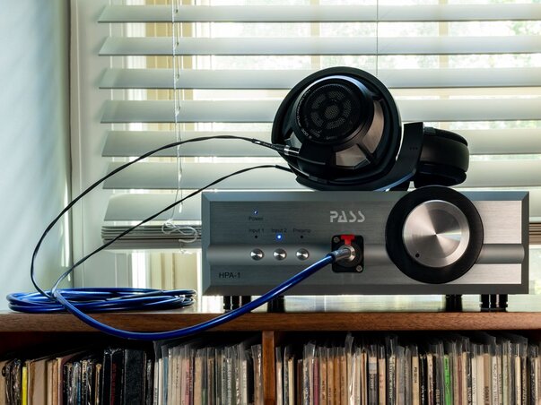 Pass Labs HPA-1 Headphone Amplifier with Sennheiser Headphones attached and placed on top of the amplifier