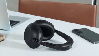 1000x on counter with phone and computer