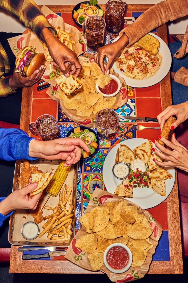 Family gathering around table at Chili's Grill & Bar