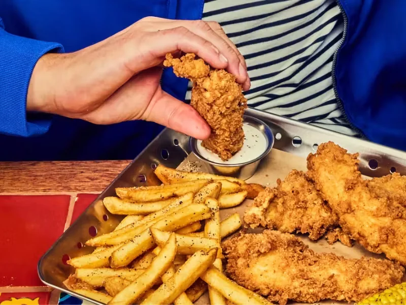 Chili's Chicken Crispers® being dunked in house-made ranch 