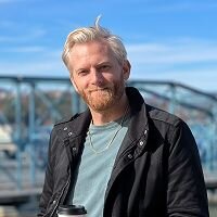 Original photo of the same man in casual clothing before the transformation.