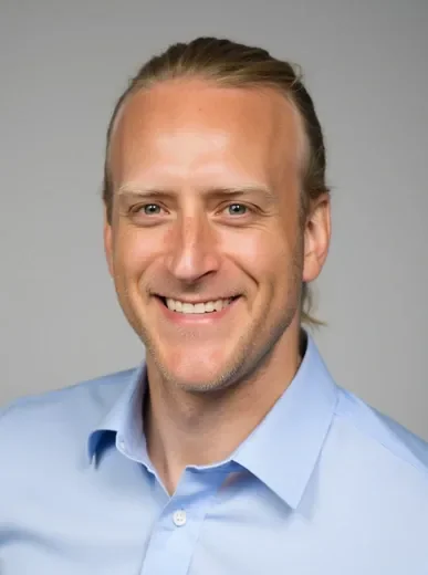 Professional AI avatar headshot of a man against a clean light background with business attire