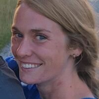 Original photo of a woman smiling naturally outdoors, used as a before image for AI transformation—reference photo for Somny’s luxury portrait generator.