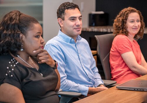 Gas South employees collaborating in a meeting at the Atlanta office