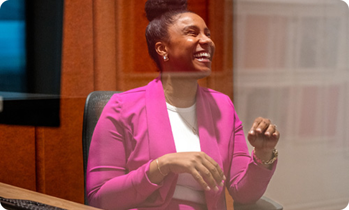 Gas South employee in pink suit laughing