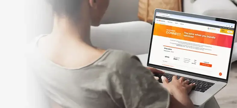 woman on laptop viewing tv and internet bundle offers