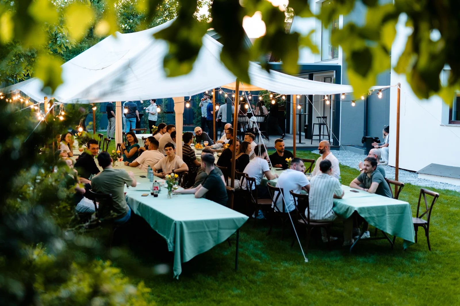 Dinner under the string lights at our summer party