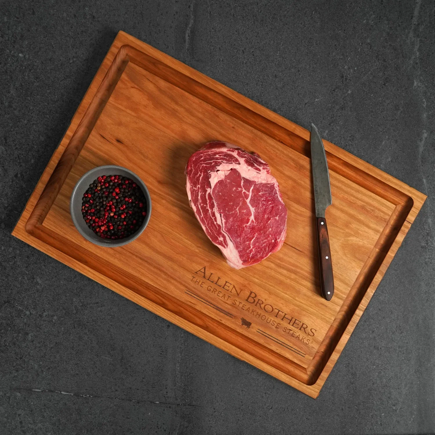 Allen Brothers choice ribeye on a branded cutting board