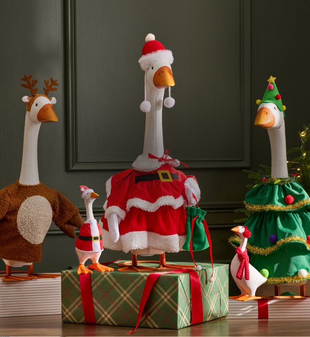 Decorative Giddy Geese dressed in festive Santa, reindeer and Christmas tree outfits.