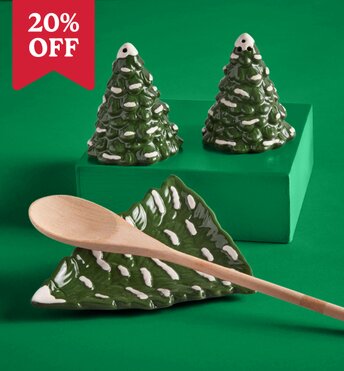 Ceramic dishes shaped like Christmas trees highlighting holiday serveware items for entertaining