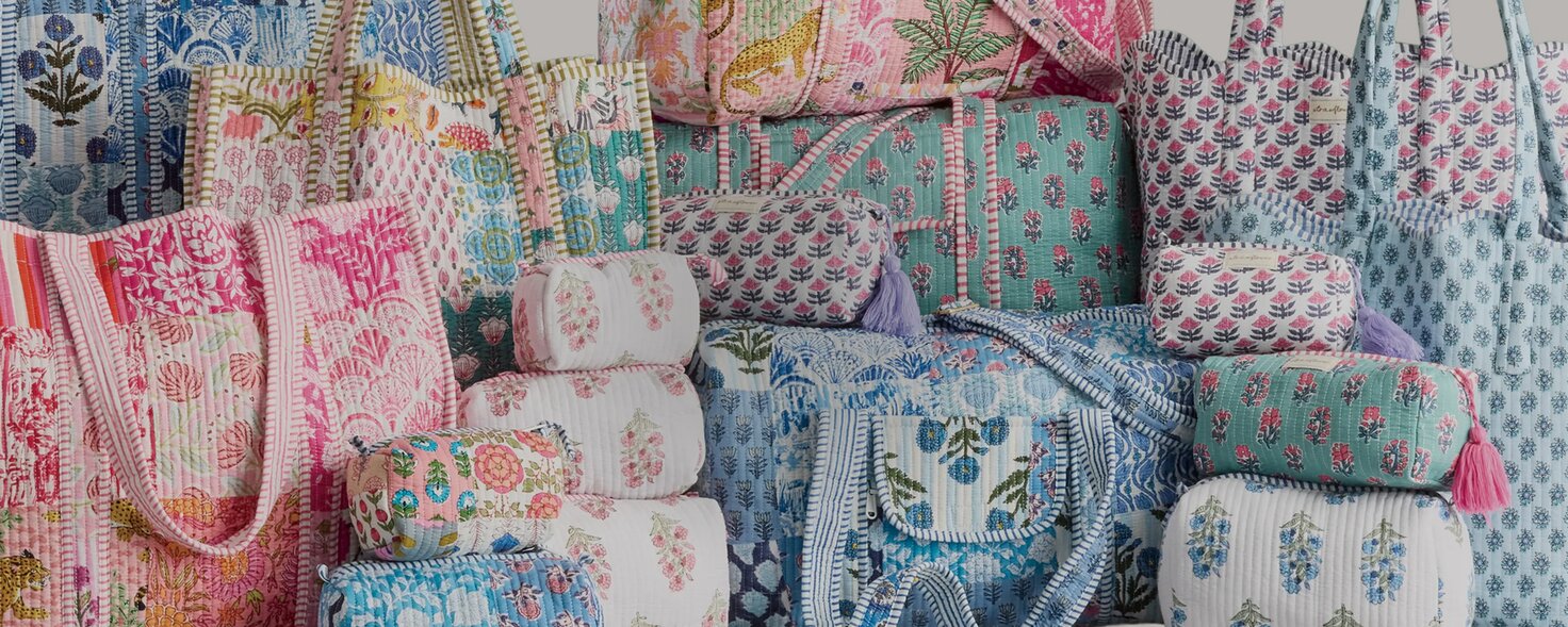 Image of patchwork strawflower tote, cosmetic bags, and duffel bags.